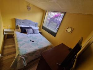 Postel nebo postele na pokoji v ubytování Casa Dohko