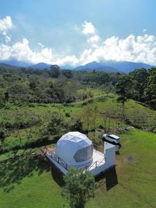 an overhead view of a white tent in a field at Glamping Venecia in Alajuela