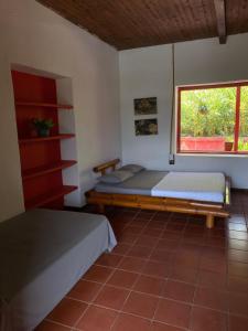 Ένα ή περισσότερα κρεβάτια σε δωμάτιο στο Hacienda la Chocha
