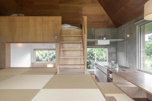 a kitchen with wooden walls and wooden ceilings at Oase Akaishi - Vacation STAY 69684v in Ibaruma