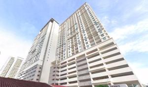 a large white building with many windows at COZY Modern Spacious 8pax S PICE Penang in Bayan Lepas