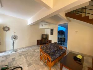 a living room with a couch and a table at JAST 9 HOMESTAY in Port Dickson