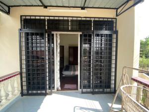 an entrance to a house with an open gate at JAST 9 HOMESTAY in Port Dickson