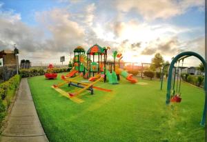 a park with a playground with a slide at Casa en San Clemente in San Clemente