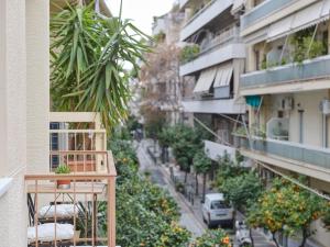 a balcony of a building with plants on it at Sunny and Comfy 2bd Apt in Kolonaki in Athens