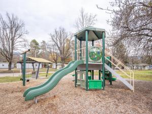 a playground with a slide in a park at NRMA Bright Holiday Park in Bright