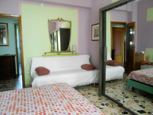 Postel nebo postele na pokoji v ubytování I Tetti Di Sassari B&B