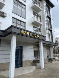 a building with a sign that reads art hotel at Art Hotel Navoiy in Navoi