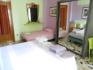 Postel nebo postele na pokoji v ubytování I Tetti Di Sassari B&B