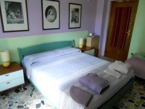Postel nebo postele na pokoji v ubytování I Tetti Di Sassari B&B