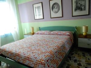 Postel nebo postele na pokoji v ubytování I Tetti Di Sassari B&B