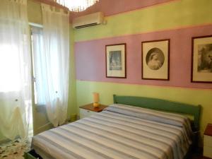 Postel nebo postele na pokoji v ubytování I Tetti Di Sassari B&B