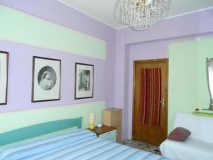 Postel nebo postele na pokoji v ubytování I Tetti Di Sassari B&B