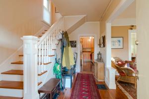 a living room with a staircase and a rug at Big beautiful house off Alberta—2 bdms sunny patio in Portland