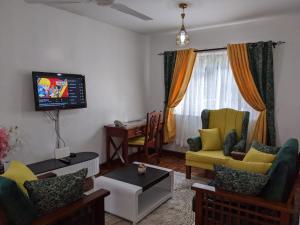 Ein Sitzbereich in der Unterkunft bliss Haven spaces paradise 1 bedroom fully furnished apartments
