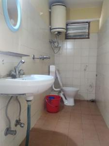 a bathroom with a sink and a toilet at LHONARK RESIDENCY in Gangtok