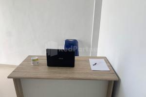 a table with a bag and a pen and a paper at Asyura Kostel Syariah Redpartner in Kedaton +16 photos