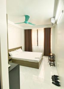 Gulta vai gultas numurā naktsmītnē GRAD Minh Trang Motel