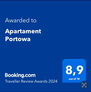 a blue screen with the text awarded to apartment portonia at Apartament Portowa in Kołobrzeg