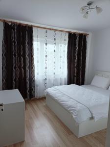 Ένα ή περισσότερα κρεβάτια σε δωμάτιο στο Apartament Tudorache Premium +7 φωτογραφίες