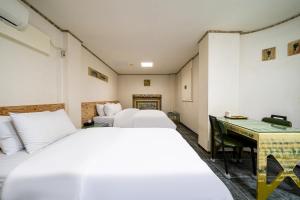 Postel nebo postele na pokoji v ubytování Hotel Aria