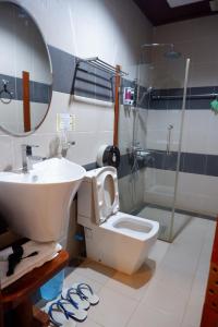 Koupelna v ubytování Kongmany Prestige Hotel