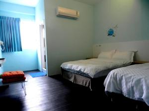 Postelja oz. postelje v sobi nastanitve Light Blue Hostel