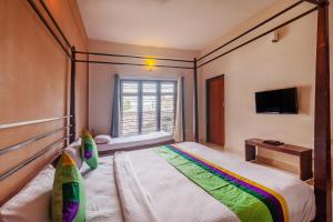 Treebo Vrindavan, 3 Km From Madikeri Fort客房内的一张或多张床位