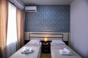 Voodi või voodid majutusasutuse Hotel Sagu toas
