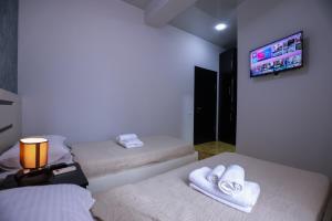 Voodi või voodid majutusasutuse Hotel Sagu toas