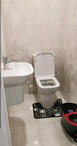 a bathroom with a white toilet and a sink at شقة سياحية مطلة على البحر in Istanbul
