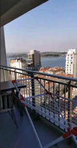 a balcony with a table and a view of the water at شقة سياحية مطلة على البحر in Istanbul