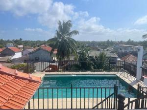 a swimming pool with a view of a city at Maeva villa with pool in Jaffna