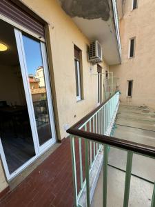 an empty balcony of a building with a glass door at CASA BENEDETTA Nuovo bilocale 100 metri dal mare in Alassio