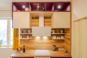 a room with a wooden table and a desk at Casa Dell'Arte in Sofia +32 photos
