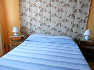 Postel nebo postele na pokoji v ubytování I Tetti Di Sassari B&B