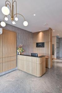 a lobby with a reception desk in a building at Macalister 288 in George Town