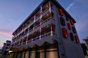 a building with lights on the side of it at Macalister 288 in George Town +33 photos