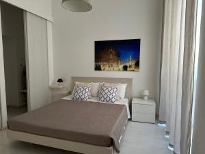 Łóżko lub łóżka w pokoju w obiekcie Rome Holiday Home