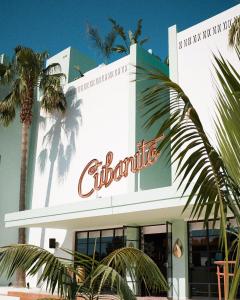 a building with a sign on the side of it at Cubanito Ibiza in San Antonio