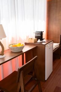 a kitchen with a counter with a bowl of fruit on it at iHouseVILLAGE in Polychrono