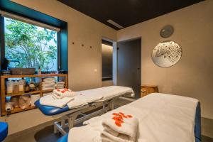 a hospital room with two beds and a window at Neptuno Apartments in Calella