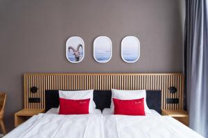Postel nebo postele na pokoji v ubytování Tailormade Hotel BAB Bachenbülach