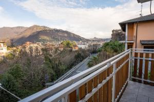 a balcony with a view of the mountains at RESIDENCE VILLA ELI in Como