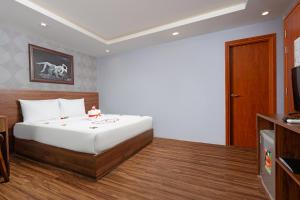 Postel nebo postele na pokoji v ubytování BIDV Beach Hotel Nha Trang