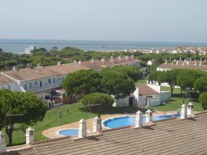 a view of a resort with a pool and houses at Miramar in Mazagón