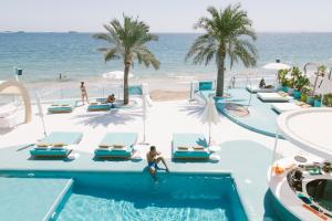 an image of a swimming pool at the beach at Dorado Ibiza - Adults Only in Playa d'en Bossa