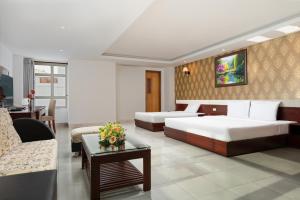 Postel nebo postele na pokoji v ubytování BIDV Beach Hotel Nha Trang