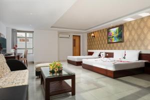 Postel nebo postele na pokoji v ubytování BIDV Beach Hotel Nha Trang