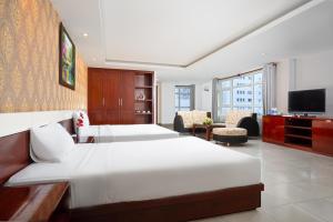 Postel nebo postele na pokoji v ubytování BIDV Beach Hotel Nha Trang